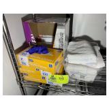 GROUP OF GLOVES AND TRASH BAGS. LOT LOCATED IN CAR