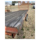 RED TANDEM AXLE HAY TRAILER. 90INX 24FT LONG.