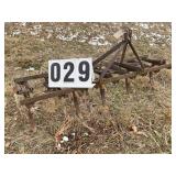 9 TOOTH SPRING CULTIVATOR, 7 FT OVERALL. APPEARS T