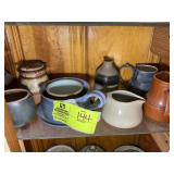 SHELF WITH POTTERY STYLE JARS, CREAMERS, ETC
