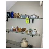GROUP OF MISC FIGURINES ON GLASS SHELVES, CARS, EL