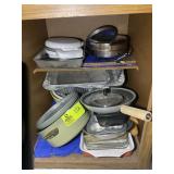 CABINET TO LEFT OF OVEN, MISC POTS AND PANS