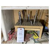 SHELF WITH DRILL BITS AND ROUTER BLADES