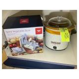 BOTTOM SHELF OF CABINET INCLUDING, CROCK POT, SPIR