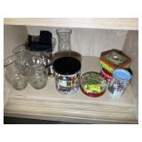 BOTTOM MIDDLE OF BUFFET, VASES, TINS, ETC