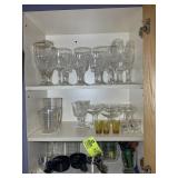 CABINET WITH ASSORTED GLASSWARE, MEASURING CUPS, E