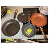 GROUP OF FRYING PANS