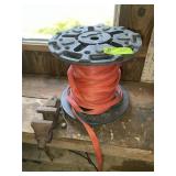LARGE SPOOL OF STRAPPING AND 3.5 IN BENCH VISE, LO