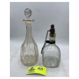 PAIR OF GLASS DECANTERS ONE WITH CORK STOPPER 12 I