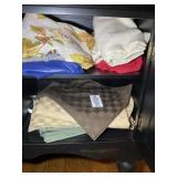 CONTENTS OF LOWER BUFFET, TABLE CLOTHS, AND PLACEM