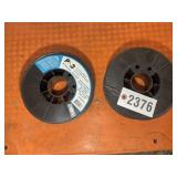 TWO PARTIAL ROLLS OF WELDING WIRE