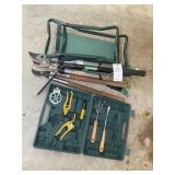 Group of gardening items, including loppers, kneel