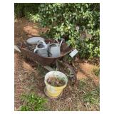 Group of watering cans, flower pot, decorative whe