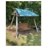 Wooden swing with frame swing is 58 inches wide