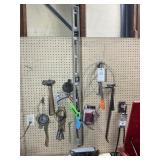CONTENTS ON WALL, INCLUDING LEVEL, HAMMERS, AND OI