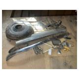 Group of vintage car parts mirrors bumpers, tire c