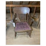 Wooden rocking chair with upholstered seat