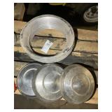 GROUP OF FOUR 14-INCH BEAUTY RINGS AND THREE HUBCA