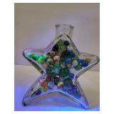 Star-Shaped Glass Bottle with Marbles Some Glowers