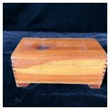 Cedar jewelry box filled with jewelry