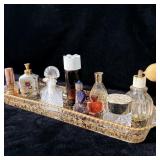 Glass tray of vintage perfume bottles