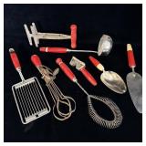 Antique red handled kitchen utensils bakelite &