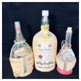 (3) Wicker Covered Glass Bottles