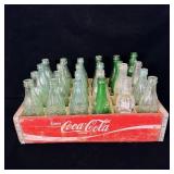 Antique Coca-Cola crate with antique pop bottles