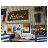 “Old School” garage display featuring vintage automotive signage, tobacco advertising, and workshop 