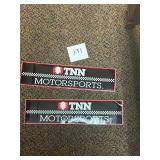 Pair of vintage auto racing bumper stickers
