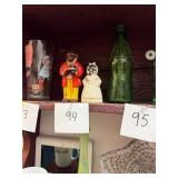 Pair of mismatched Black Americana salt shakers