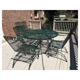 Wrought iron patio table and four chairs
