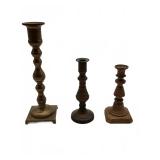 Three brass candlestick holders