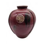 Red ceramic vase