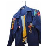 Boy Scouts uniform shirt with patches and medal