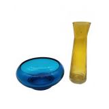 Blue glass bowl with yellow vase