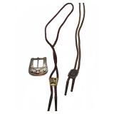 Bolo ties with western slide clips and belt buckle