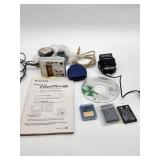 Fujifilm FinePix F401 camera with accessories