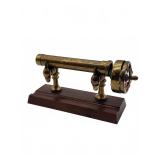 Brass and glass kaleidoscope on wood base