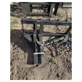 Skid steer post/stump puller.