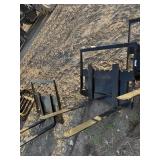 1 set of mini skid steer pallet forks.