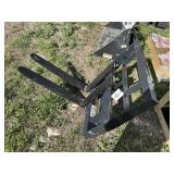 Mini skid steer pallet forks.