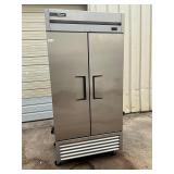 True commercial 2 door refrigerator on casters
