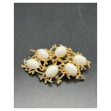 Vintage gold tone white Cabochon brooch pin.