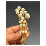 Vintage gold tone brooch with faux pearls.