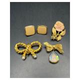 There Brooches and a pair of Napier earrings.