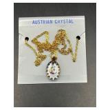 gold-tone chain necklace featuring a crescent moon