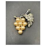 Vintage brooch. Grapes and leaves.