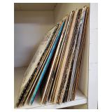 An Assortment Of Records With Artist Like Paula