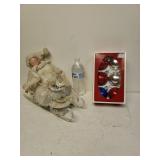 Christmas Ornaments And Baby On Sled